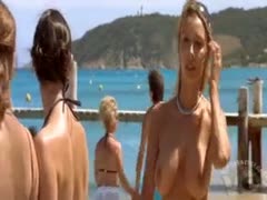 Large nude breasts while masturbating on the beach